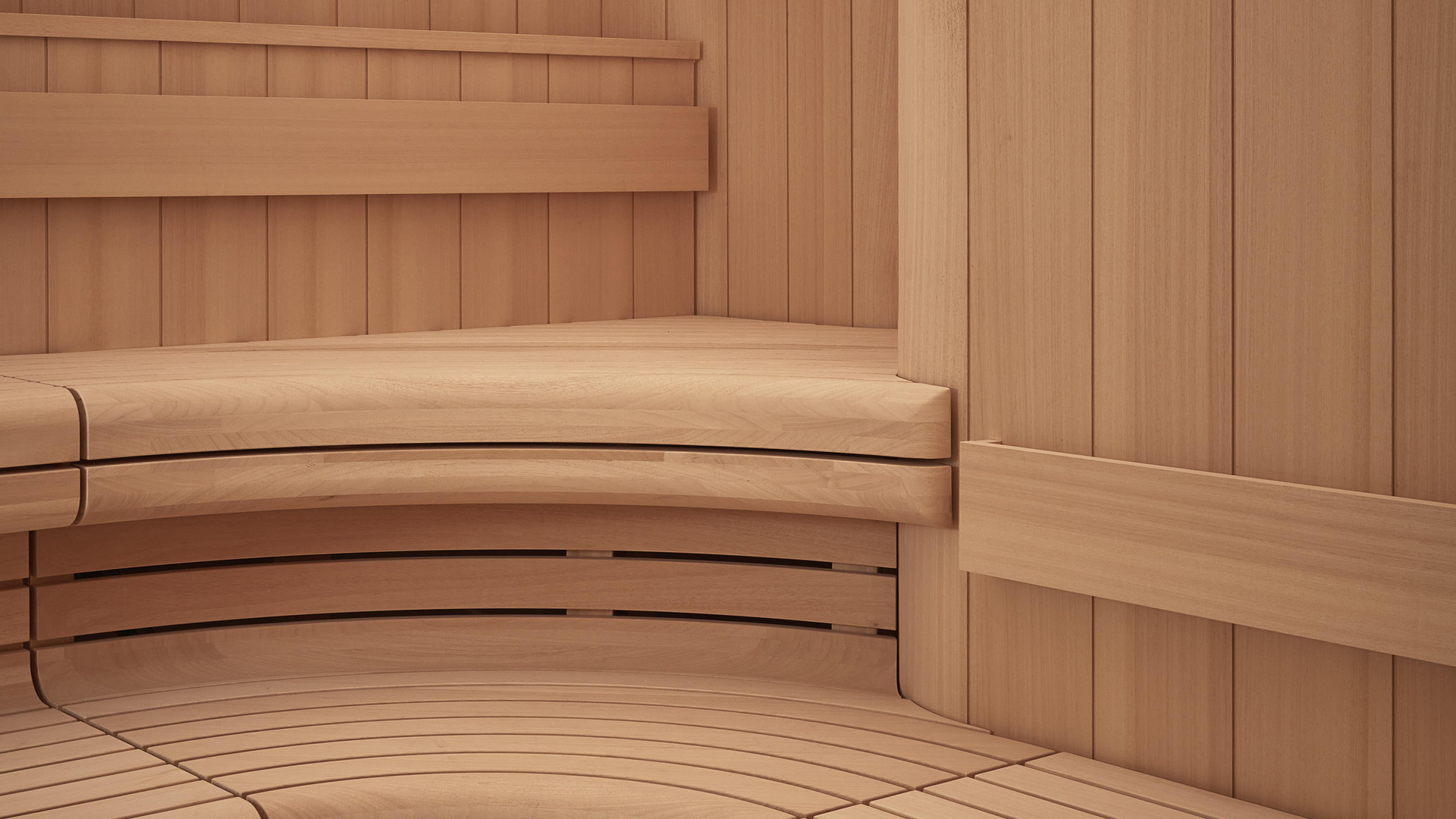 A serene sauna space with smooth, curved wooden benches and soft, ambient lighting. The minimalist design and warm wood tones create an inviting atmosphere for relaxation and rejuvenation.