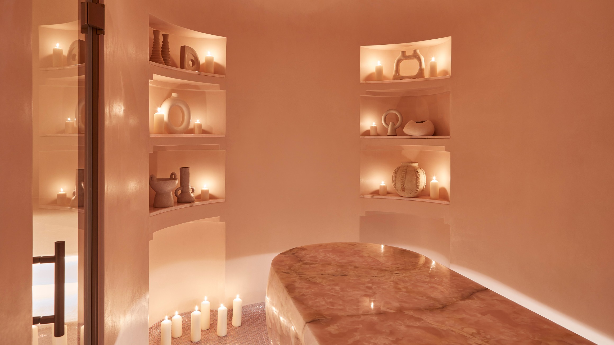 A serene sanctuary adorned with soft lighting, warm hues, and artisanal accents, offering a tranquil escape for relaxation.